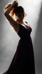 Poster - Beautiful sexy woman in a black low-cut dress that hugs her body, perfect body. Luxurious, seductive, gorgeous, attractive, charming and elegant.