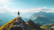 © Inspire Shots Hub - A hiker stands on a mountain peak, taking in the breathtaking view of the surrounding mountain ranges