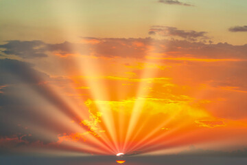 Wall Mural - sunset dramatic sky background with sun and sunset clouds