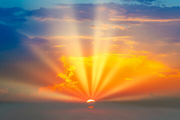 Wall Mural - sunset dramatic sky background with sun and sunset clouds