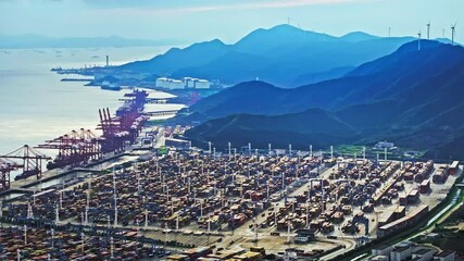 Aufkleber - Aerial shot of cargo container shipping terminal and mountains and seascape