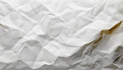 Wrinkled white paper texture showcasing natural creases and shadows in soft light for artistic or design purposes