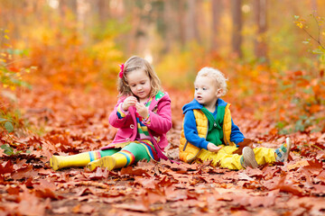 Wall Mural - Kids playing in autumn park