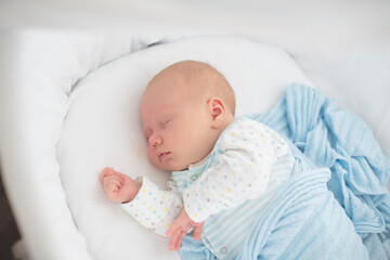 Wall Mural - little baby on white bed