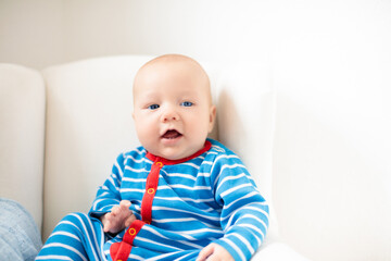 Wall Mural - little baby on white bed