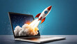 © netsay - A rocket launching from a laptop symbolizes digital innovation and creativity in a modern workspace