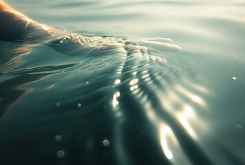 Poster - A person's hand is submerged in the water with sunlight reflecting off of it. AI.