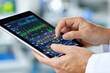 © sharafmaksumov - A Doctor Using A Tablet To Review Patient Records And Update Medical Charts During A Consultation, Showcasing Digital Health Management