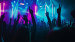 © Curioso.Photography - Crowd of people with raised hands at a concert under colorful lighting, enjoying live music.