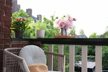 Sticker - Different plants on railings and chair at cozy balcony outdoors