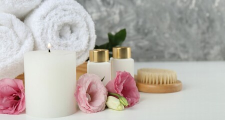 Sticker - Composition with different spa supplies on white table, closeup