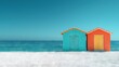 © Alice - A vibrant pair of beach huts rest atop golden sand beside the vast blue sea, framed by an azure sky above
