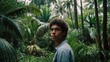 © Nemanja - Person standing in dense tropical jungle with short hair and light-colored clothing