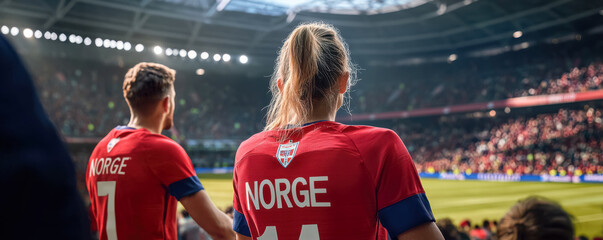 Players from Norway's Team Focused on the Game. A dynamic shot of two soccer players wearing 