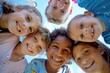 © Asier - Group of kids smiling and looking at the camera against blue sky in elementary school
