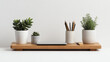 © Marketplace - A minimalist desk setup featuring potted plants, wooden organizer, and stationery on a clean surface, ideal for productivity and aesthetics.
