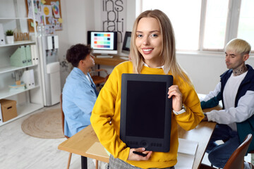 Female graphic designer working with tablet in office