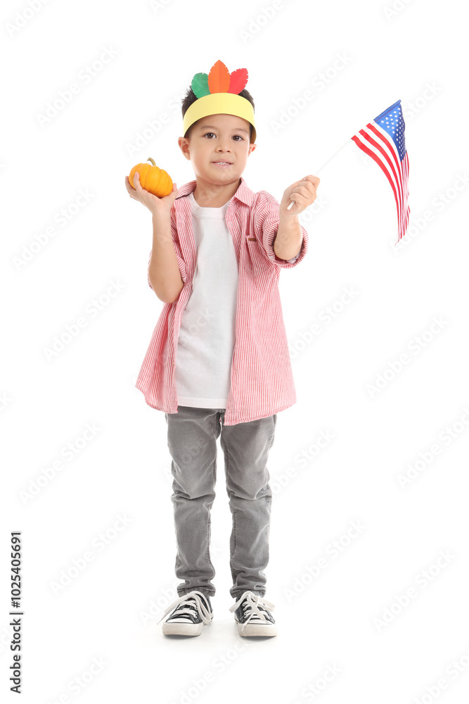 Cute little boy with pumpkin and USA flag on white background. Thanksgiving Day celebration