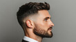 © Marketplace - Profile view of a well-groomed man with a stylish haircut, showcasing a confident expression against a neutral background.