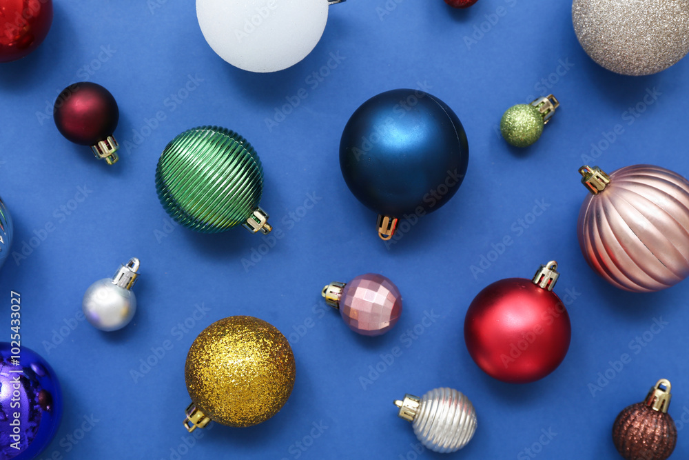 Composition with Christmas balls on blue background