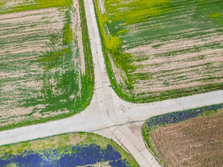 aerial top vie on the crossroad with canola blossoms and lavender in qinghai lake, china