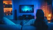 © Intania - Woman Relaxing on a Couch While Watching TV in a Dark Room