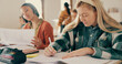 © David/peopleimages.com - Education, writing and students in high school for exam, assignment and knowledge development. People, learning and language assessment in classroom for growth, course or thinking for problem solving
