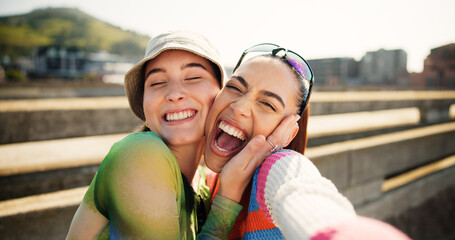 city, selfie and excited women hug, smile and laugh with cool streetwear on bridge together. social 