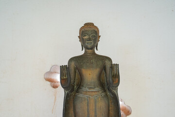 A broken buddha statue in Wat Pha That Luang in Vientiane, Laos