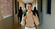 © David/peopleimages.com - Smile, hallway and portrait of student at school with backpack for learning, studying or knowledge. Happy, teenager and girl from Mexico in corridor of academy for education class with scholarship.