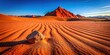 © Hugnaka - Close-up of red sand and unique rock formation in dry arid desert landscape