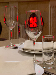 Wall Mural - A table with a white plate and a red napkin