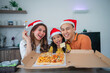 © Odua Images - asian little family enjoying christmas dinner together in dining room