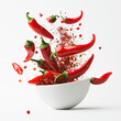 © NORN - Spicy Chili Pepper Explosion: Red chili peppers burst from a white bowl, creating a vibrant, dynamic composition. The chili flakes add a touch of heat and spice to the image.