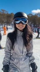 Poster - A woman in a ski suit is smiling and posing for a picture