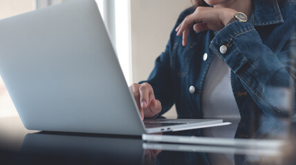 Wall Mural - business woman working on laptop computer. woman freelancer working from home office. student online