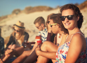 Wall Mural - Happy, woman and beach with friends for holiday and summer travel together with guitar, drinks and music. Social, group and young people outdoor by sea in Florida on weekend break or vacation