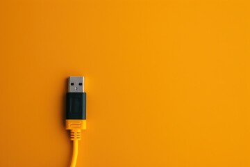 USB cable on a vibrant yellow background