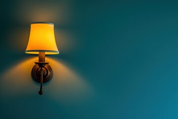 Wall Mural - Soft yellow wall lamp illuminating teal wall in a cozy interior setting