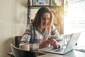 Canvas Print - Woman, freelancer and phone for remote work in home, networking and laptop for copywriting. Female person, communication and message business contact to consult, copywriter and online to email client