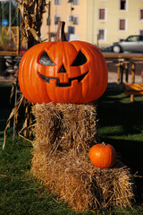 halloween decoration with spooky face pumpkins on an outdoor field festival 