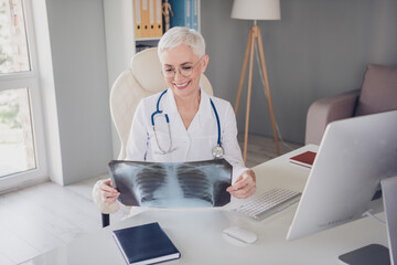 Poster - Photo of aged woman qualified doctor look lungs x-ray wear white coat workplace office indoors