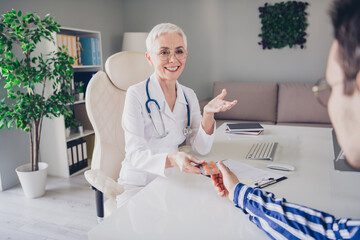 Poster - Photo of aged woman qualified doctor communicate give medication patient wear white coat workplace office indoors