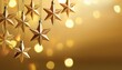 © Sam - hanging shiny christmas stars on bright golden background festive decoration for christmas eve greeting card concept with copy space