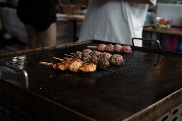 Grilled meat skewers in a herb marinade on a grill pan, top view, Fresh turkey meat skewers, Kabab, beef, street food