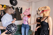 © PintoArt - Friends wearing animal masks having fun at a house party