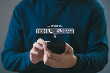 person using smartphone with contact us icons for email, phone, and chat, representing customer serv