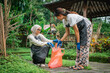 © Odua Images - hijab woman collects plastic bottle with female friend in outdoor park, recycle concept