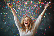 © mattegg - Ecstatic person celebrating with colorful confetti in a joyful moment indoors during a lively party