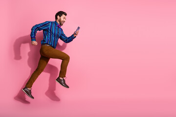 Canvas Print - Photo of cheerful man wear stylish clothes hurrying running empty space isolated on pink color background